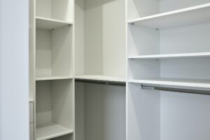 The empty shelves in the wardrobe